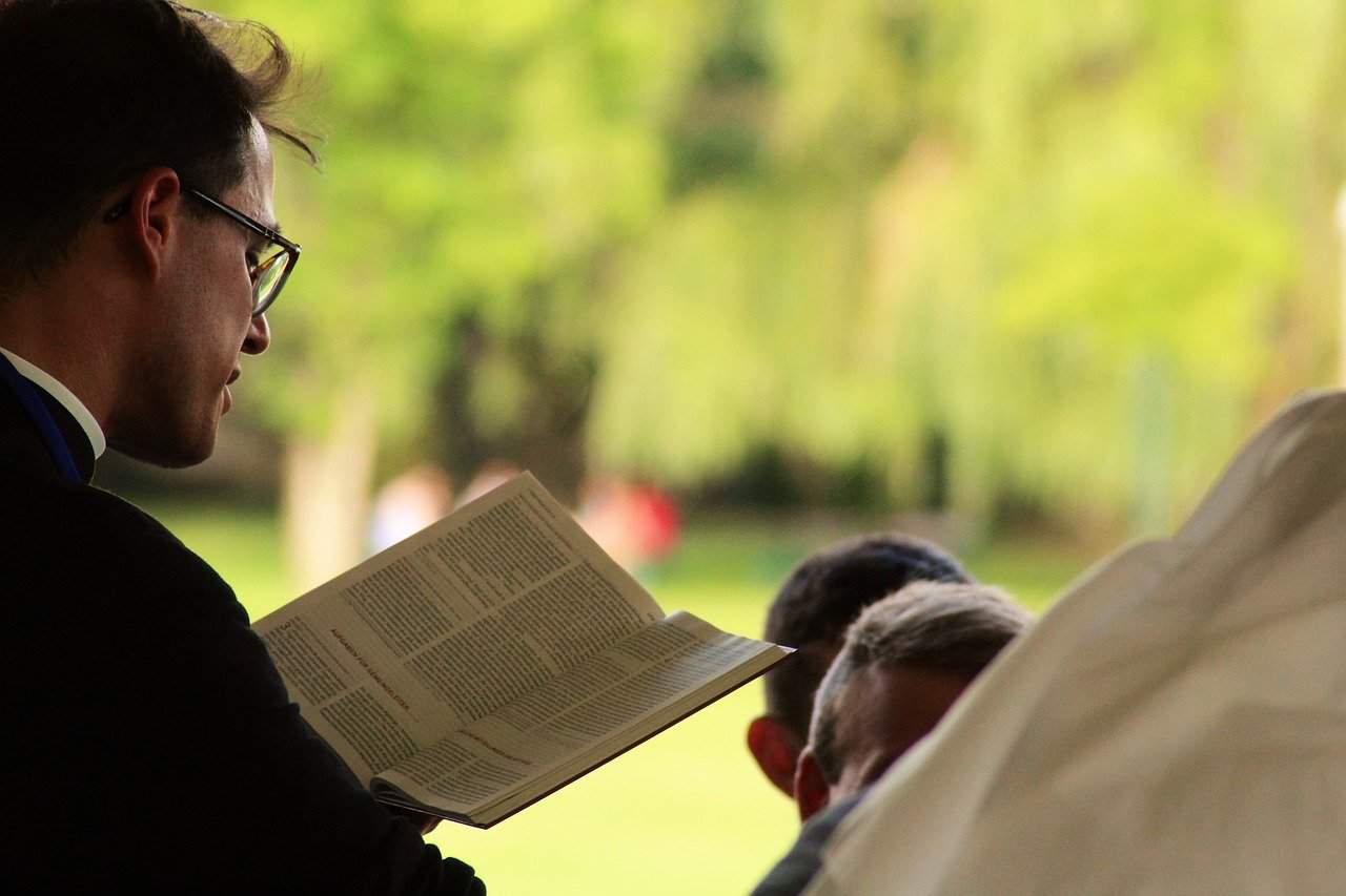 priest reading bible