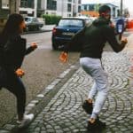 women chasing a man
